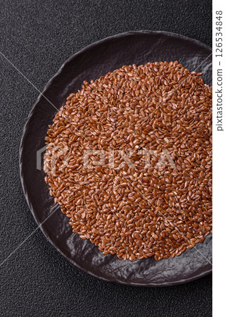Flax seeds in a bowl, an ingredient for making vegan or vegetarian food 126534848