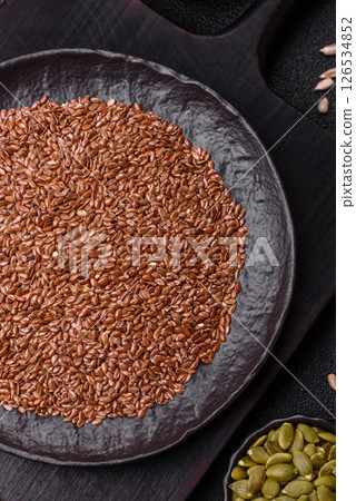 Flax seeds in a bowl, an ingredient for making vegan or vegetarian food Flax seeds in a bowl, an ingredient for making vegan or vegetarian food 126534852