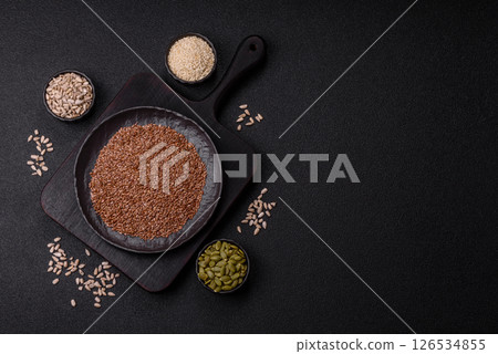 Flax seeds in a bowl, an ingredient for making vegan or vegetarian food 126534855