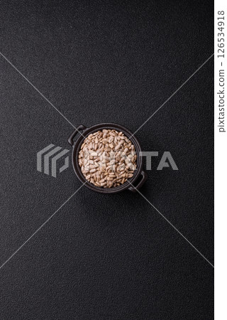 Peeled sunflower seeds in a bowl, an ingredient for making vegetarian food 126534918