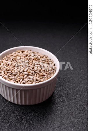 Peeled sunflower seeds in a bowl, an ingredient for making vegetarian food Peeled sunflower seeds in a bowl, an ingredient for making vegetarian food 126534942