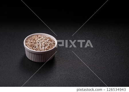 Peeled sunflower seeds in a bowl, an ingredient for making vegetarian food Peeled sunflower seeds in a bowl, an ingredient for making vegetarian food 126534943