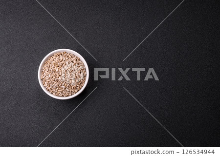 Peeled sunflower seeds in a bowl, an ingredient for making vegetarian food 126534944
