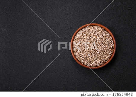 Peeled sunflower seeds in a bowl, an ingredient for making vegetarian food 126534948