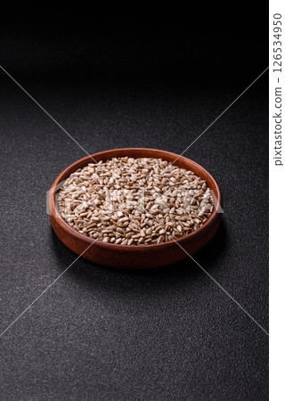 Peeled sunflower seeds in a bowl, an ingredient for making vegetarian food Peeled sunflower seeds in a bowl, an ingredient for making vegetarian food 126534950