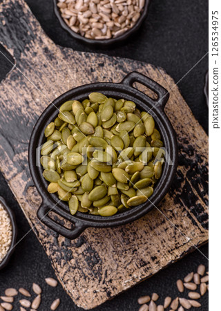 Peeled pumpkin seeds in a bowl, an ingredient for making vegetarian food 126534975