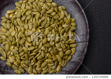 Peeled pumpkin seeds in a bowl, an ingredient for making vegetarian food 126534990