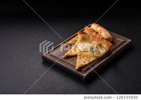 Delicious sweet pizza with pear, gorgonzola cheese and nuts 126535030