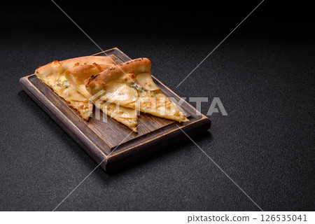 Delicious sweet pizza with pear, gorgonzola cheese and nuts Delicious sweet pizza with pear, gorgonzola cheese and nuts 126535041