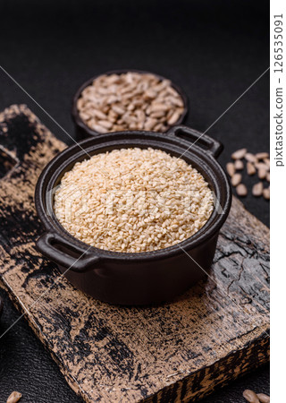 White sesame seeds in a bowl, an ingredient for making vegetarian food 126535091