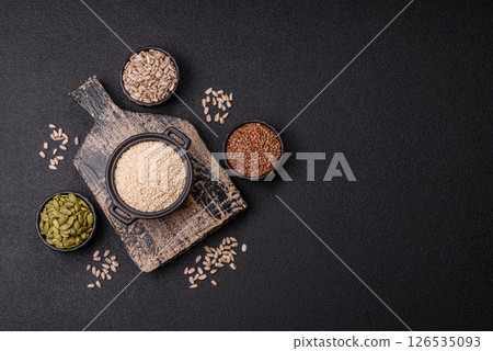 White sesame seeds in a bowl, an ingredient for making vegetarian food 126535093