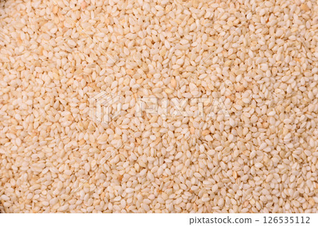 White sesame seeds in a bowl, an ingredient for making vegetarian food White sesame seeds in a bowl, an ingredient for making vegetarian food 126535112