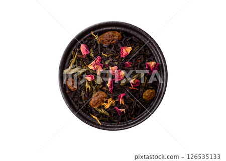 Dry tea mix blend black, green and flower petals in bowl Dry tea mix blend black, green and flower petals in bowl 126535133