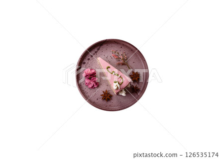 A piece of pink layered cake with strawberry flavor 126535174