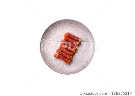 Cheese and meat, jamon or prosciutto rolled into a roll 126535214