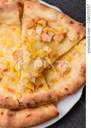Hawaiian pizza with chicken, pineapple, corn and cheese Hawaiian pizza with chicken, pineapple, corn and cheese 126535257