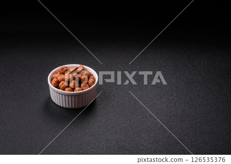 Raw hazelnuts without shells in a bowl Raw hazelnuts without shells in a bowl 126535376