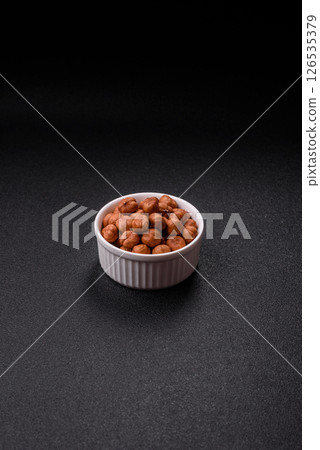Raw hazelnuts without shells in a bowl 126535379