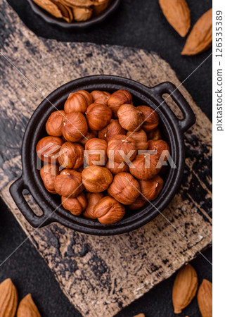 Raw hazelnuts without shells in a bowl 126535389