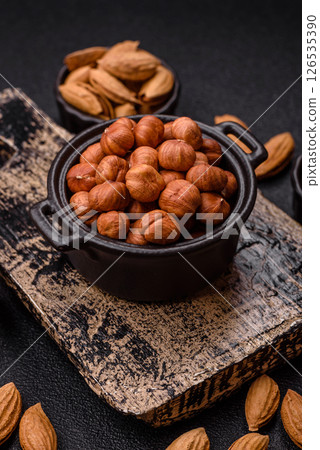 Raw hazelnuts without shells in a bowl 126535390
