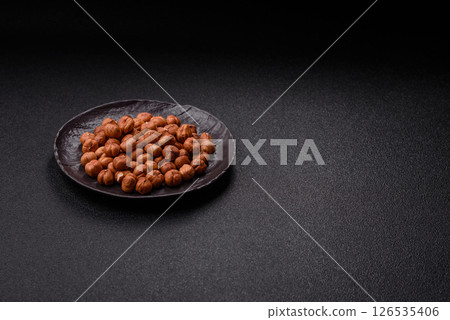 Raw hazelnuts without shells in a bowl 126535406