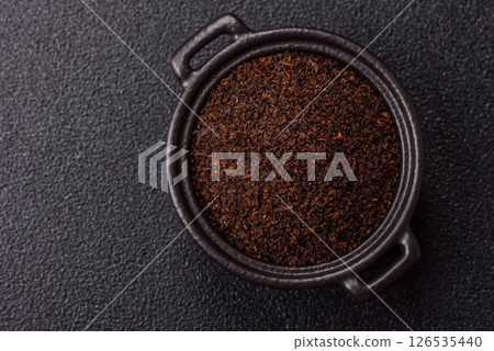 Black tea dry crushed in bowl Black tea dry crushed in bowl 126535440