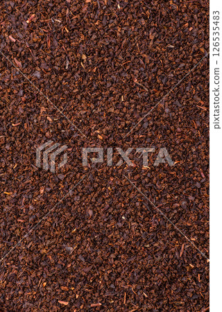 Black tea dry crushed in bowl 126535483