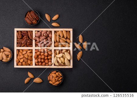 Wooden box with nuts cashew, hazelnut, almond, brazil, pecan, walnut 126535516