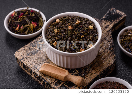 Dry green tea with soursop piece, knapweed petals in bowl Dry green tea with soursop piece, knapweed petals in bowl 126535530