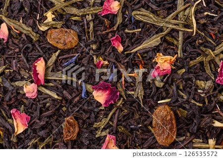 Dry tea mix blend black, green and flower petals in bowl 126535572