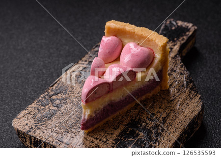 Sweet cheesecake with berry flavor, decorated with pink hearts Sweet cheesecake with berry flavor, decorated with pink hearts 126535593