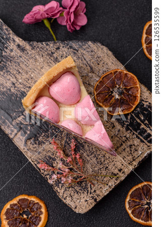Sweet cheesecake with berry flavor, decorated with pink hearts 126535599