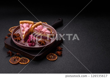 Sweet cheesecake with berry flavor, decorated with pink hearts 126535617