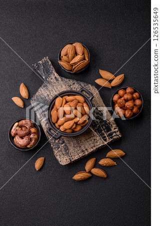 Roasted or raw peeled almonds in bowl Roasted or raw peeled almonds in bowl 126535649