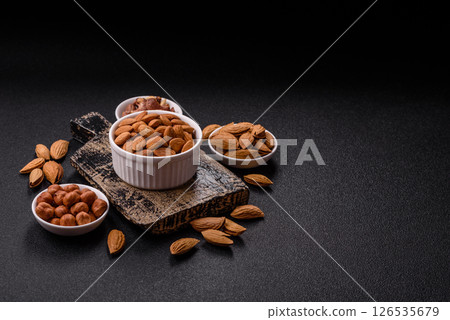 Roasted or raw peeled almonds in bowl Roasted or raw peeled almonds in bowl 126535679