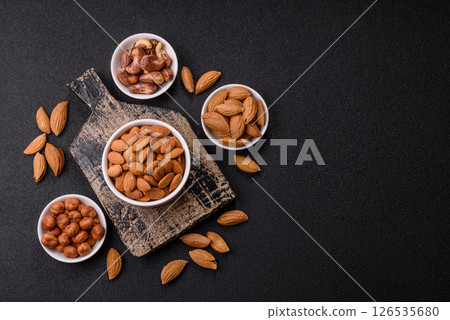 Roasted or raw peeled almonds in bowl Roasted or raw peeled almonds in bowl 126535680