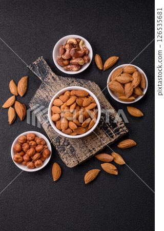 Roasted or raw peeled almonds in bowl 126535681