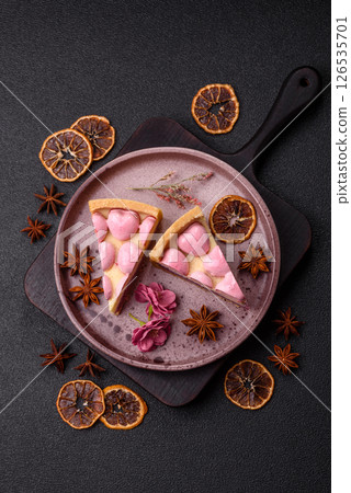 Sweet cheesecake with berry flavor, decorated with pink hearts Sweet cheesecake with berry flavor, decorated with pink hearts 126535701