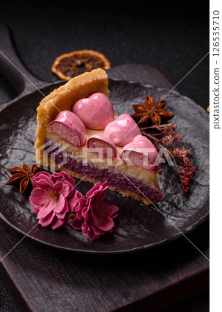Sweet cheesecake with berry flavor, decorated with pink hearts 126535710