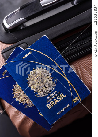 International passport of a citizen of Brasil on a suitcase International passport of a citizen of Brasil on a suitcase 126535834