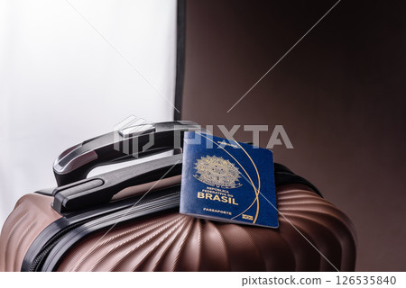 International passport of a citizen of Brasil on a suitcase 126535840