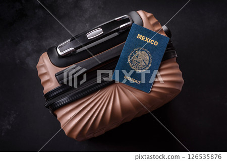 International passport of a citizen of Mexico on a suitcase International passport of a citizen of Mexico on a suitcase 126535876