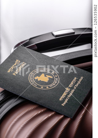 International passport of a citizen of Bangladesh on a suitcase International passport of a citizen of Bangladesh on a suitcase 126535902