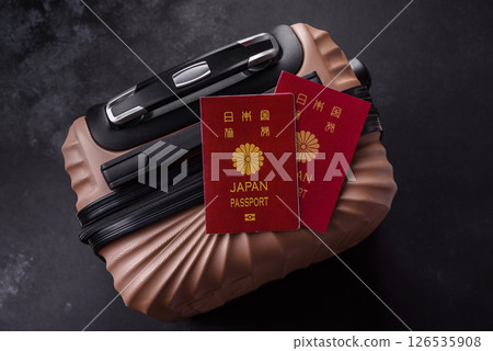 International passport of a citizen of Japan on a suitcase 126535908