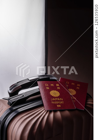 International passport of a citizen of Japan on a suitcase 126535910