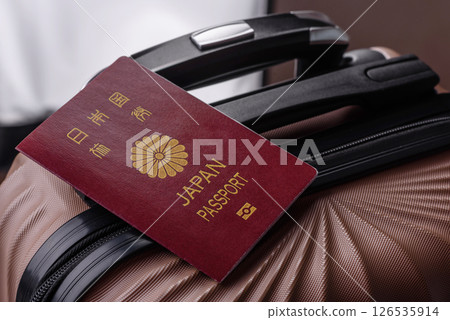 International passport of a citizen of Japan on a suitcase 126535914