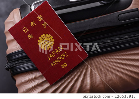 International passport of a citizen of Japan on a suitcase 126535915