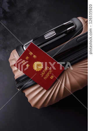 International passport of a citizen of Japan on a suitcase 126535920