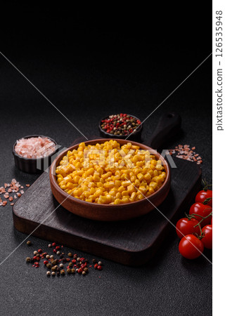 Sweet yellow canned corn in bowl 126535948