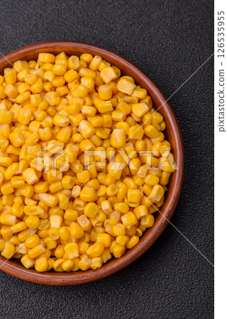 Sweet yellow canned corn in bowl 126535955